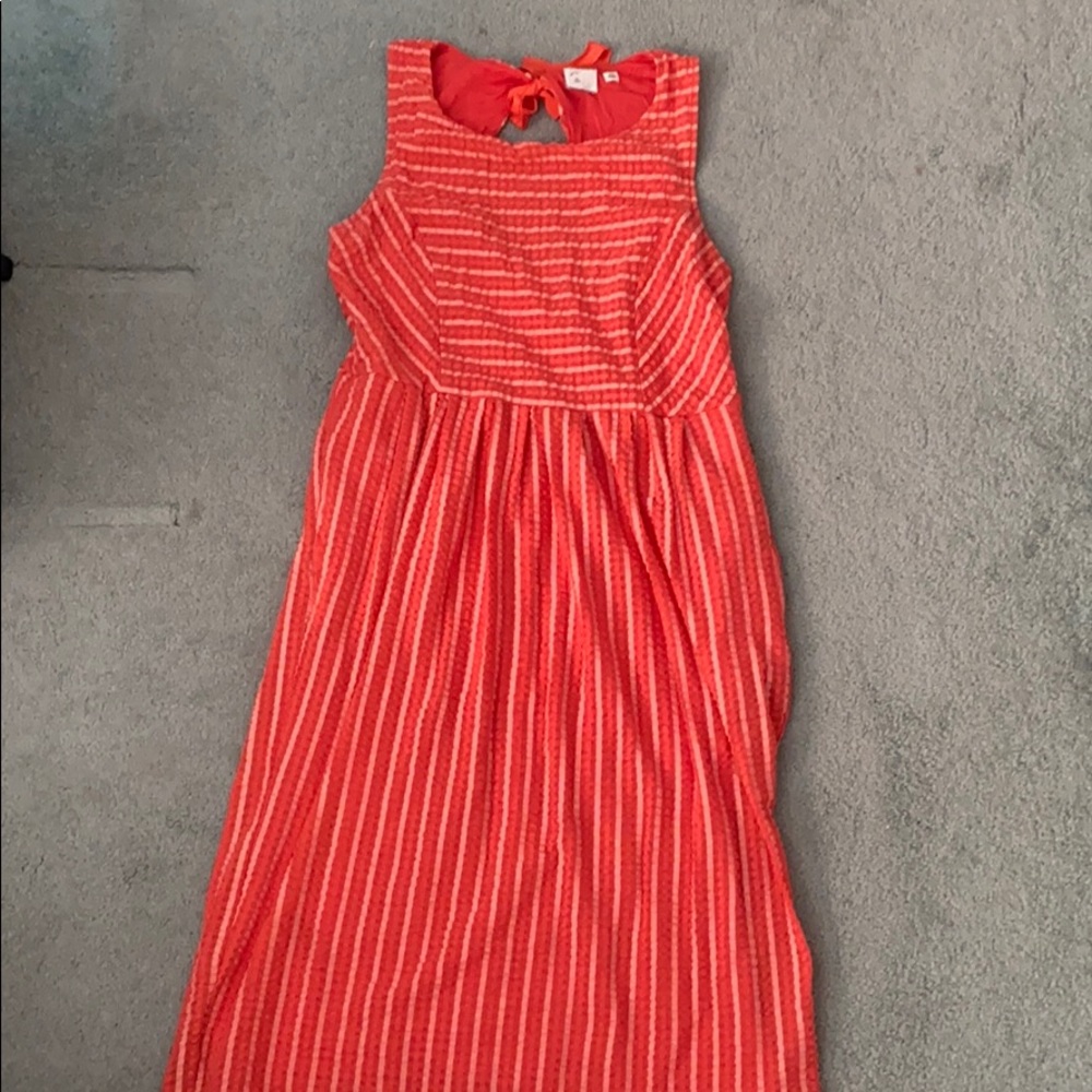 Orange sleeveless knee length dress with pockets